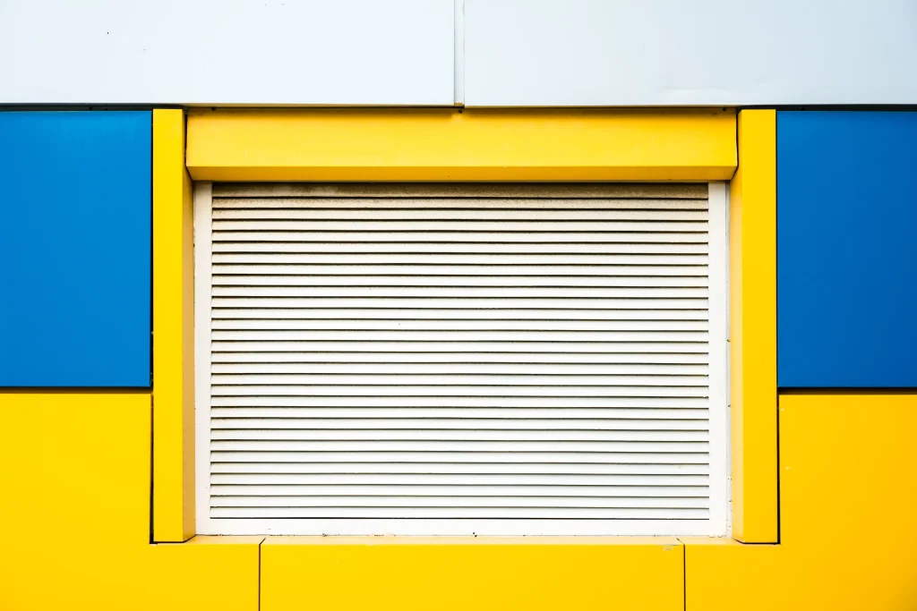 closeup-shot-of-a-yellow-and-blue-wall-with-closed