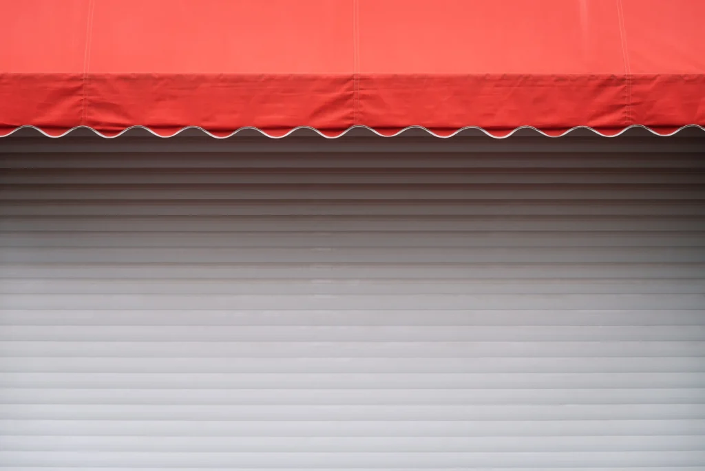 white-stall-with-red-sunshade